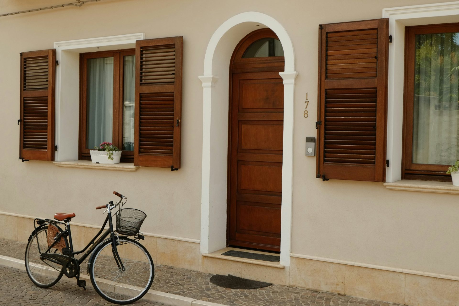 A bicycle parked in front of a house